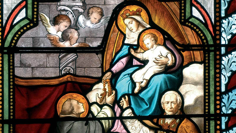 Blessed Mother giving the rosary